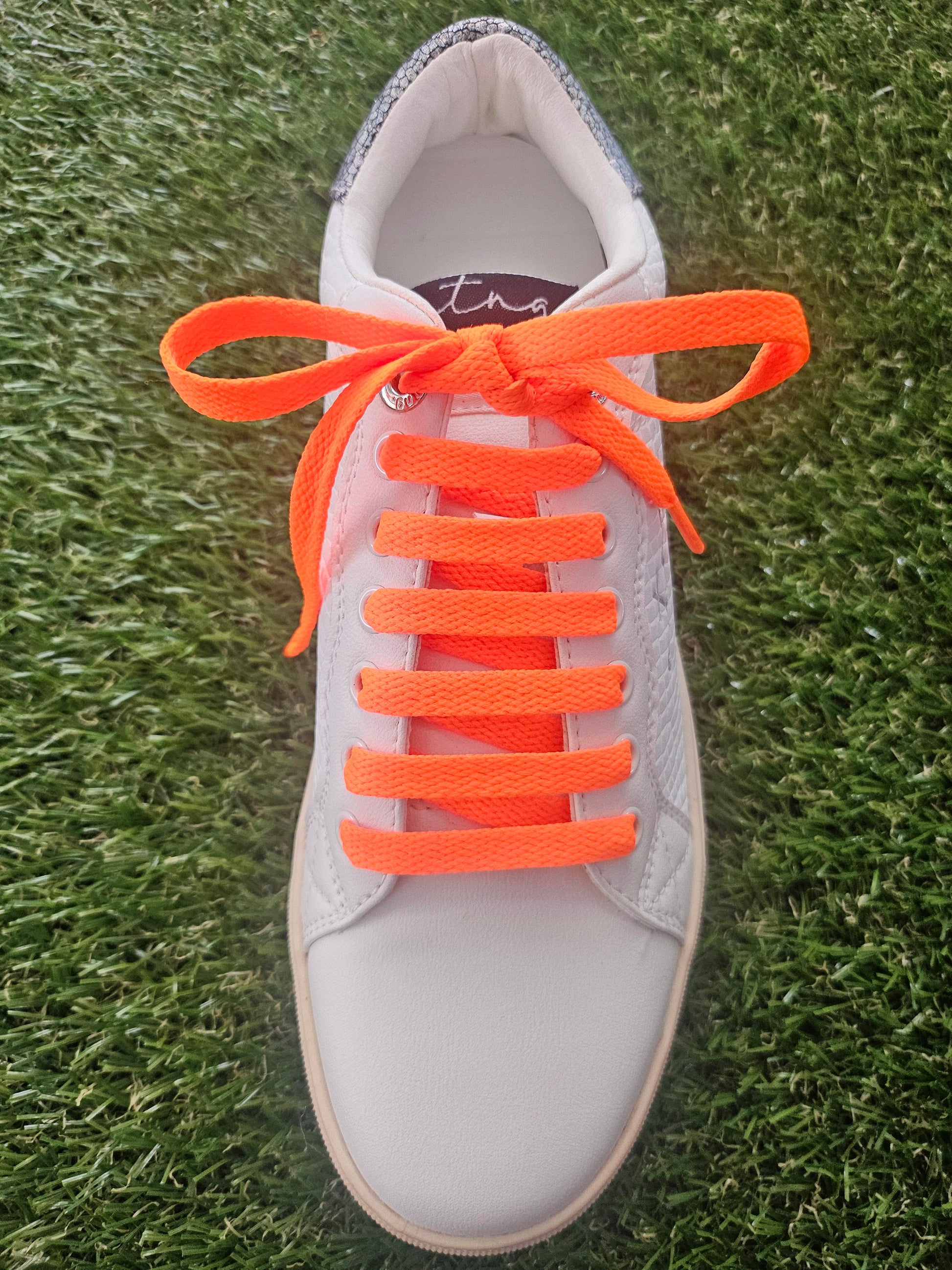 Neon orange shoelaces close-up – vivid coloured laces for trainers