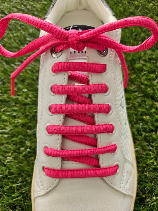 bright pink shoe laces on a white trainer