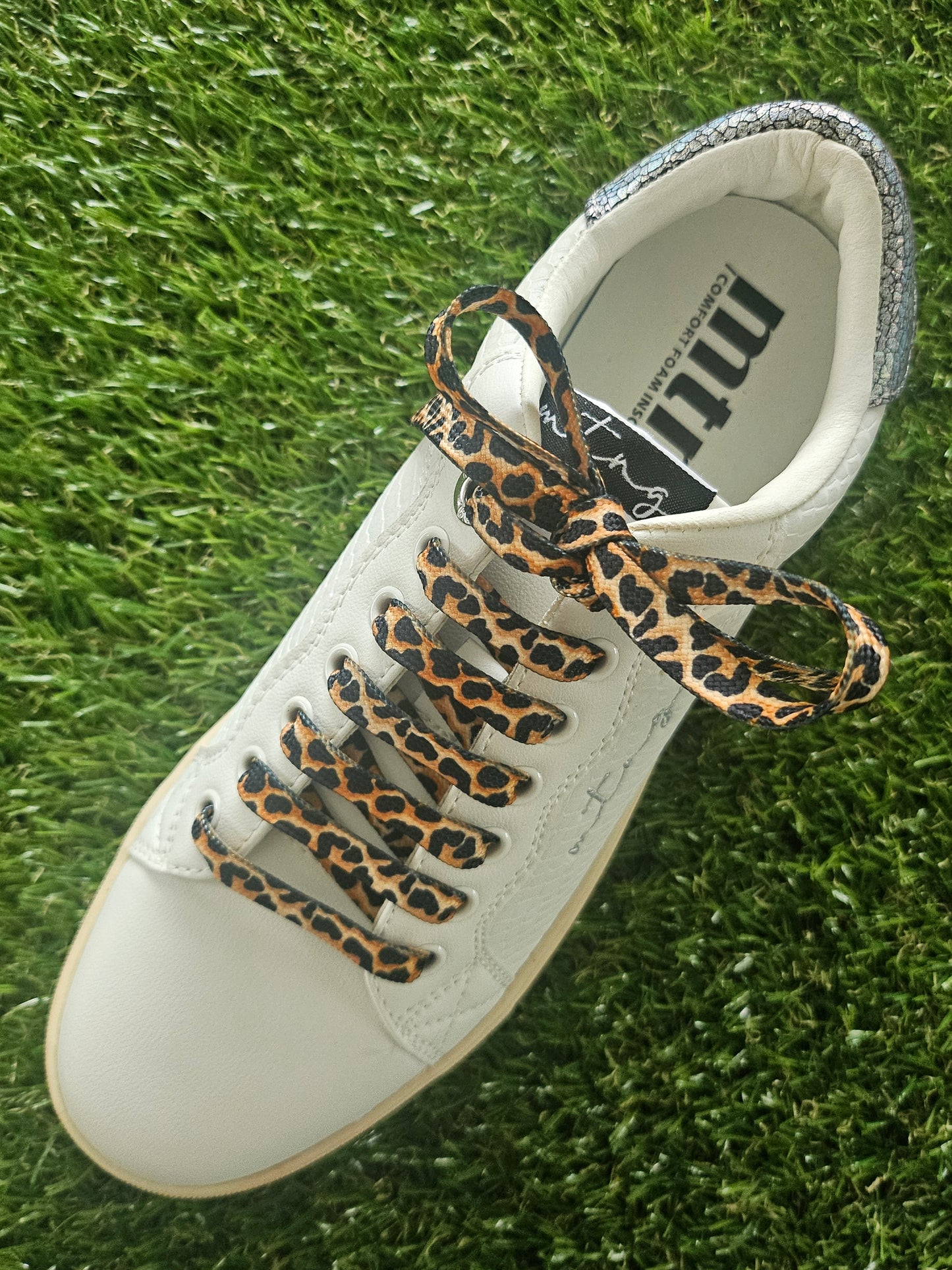 Brown leopard print shoelaces flat lay – animal print trainer laces