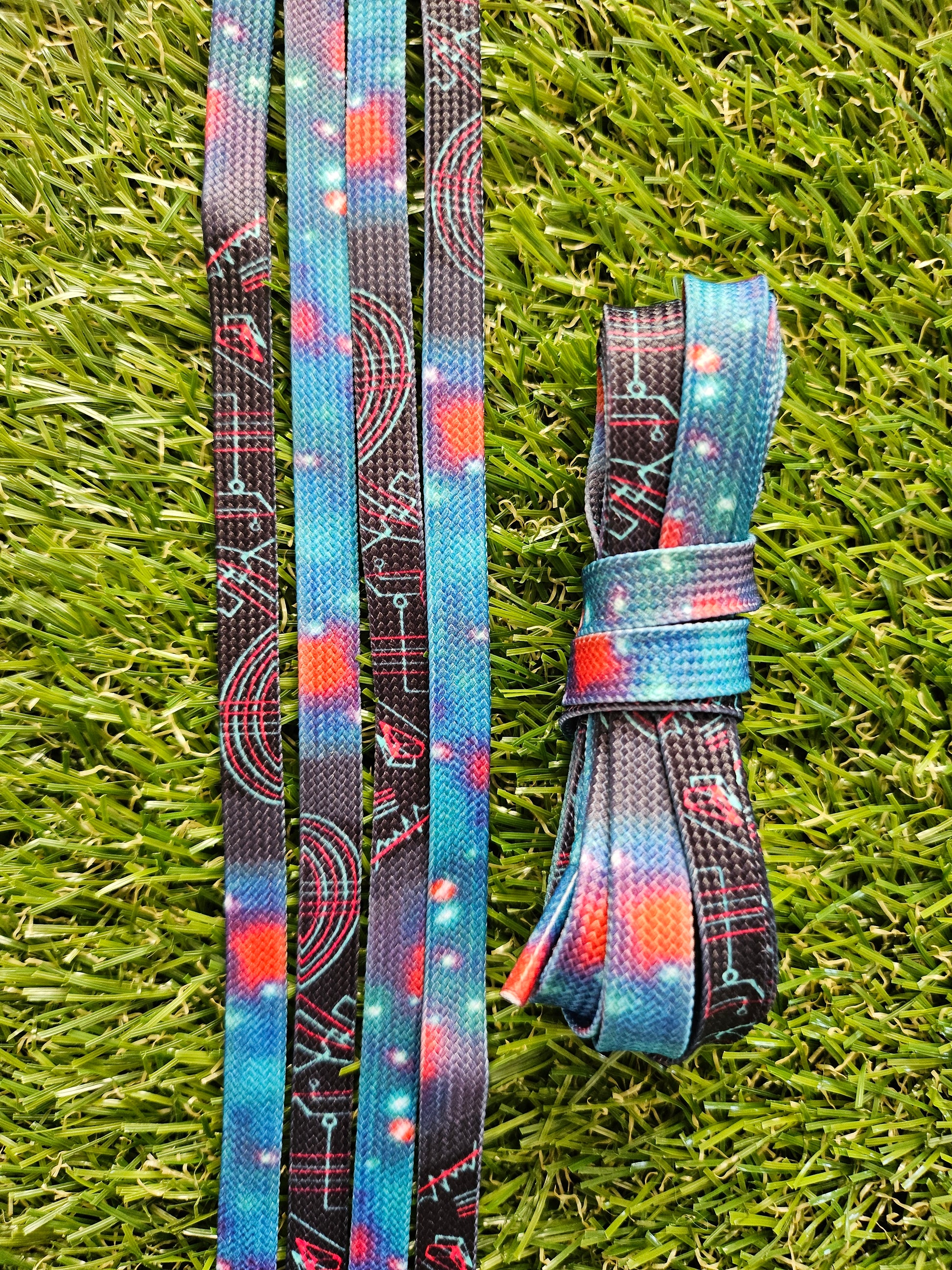 Black Space Design Shoelaces on green grass