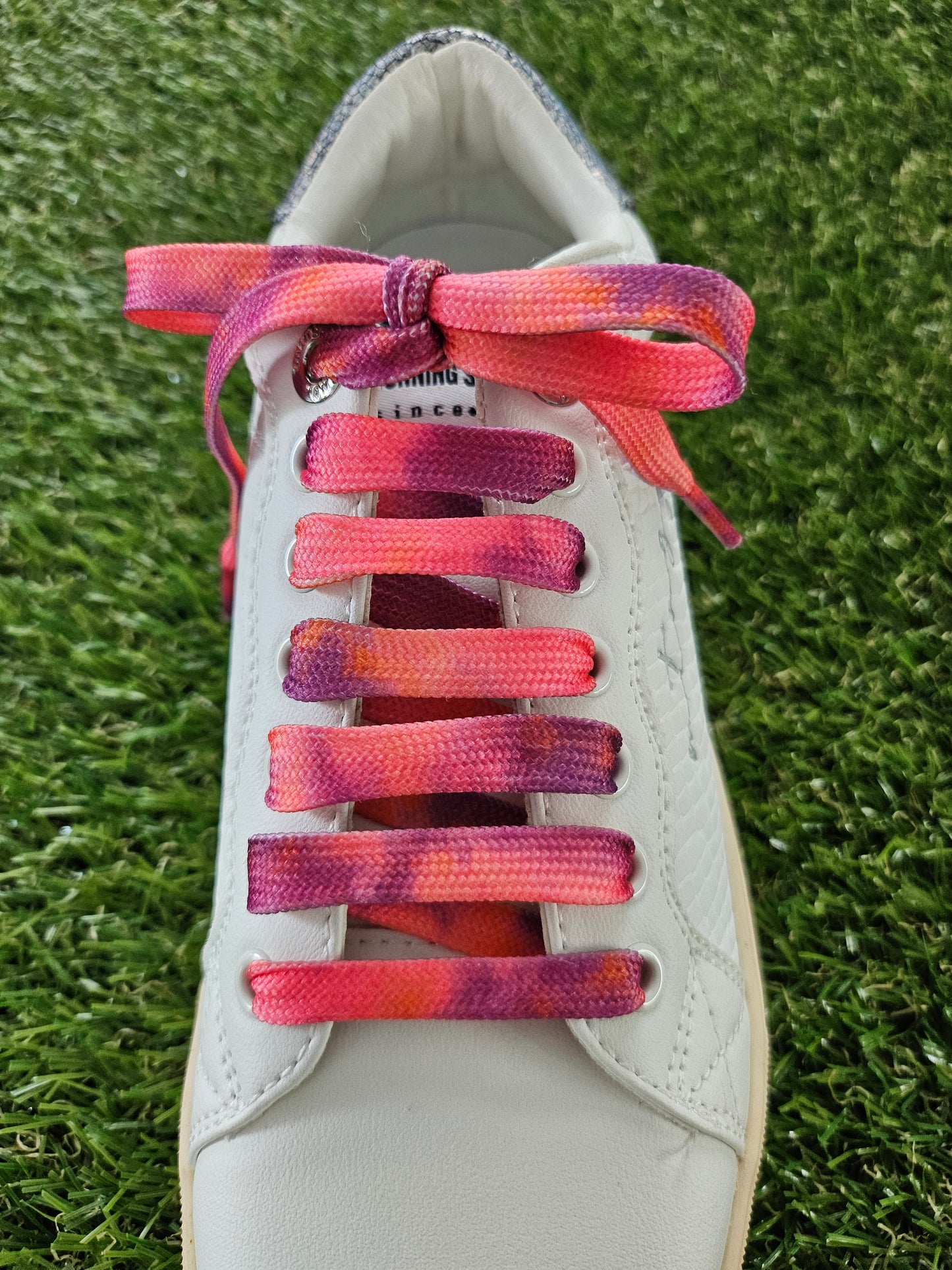 Peach Melba Coloured Shoelaces on green grass
