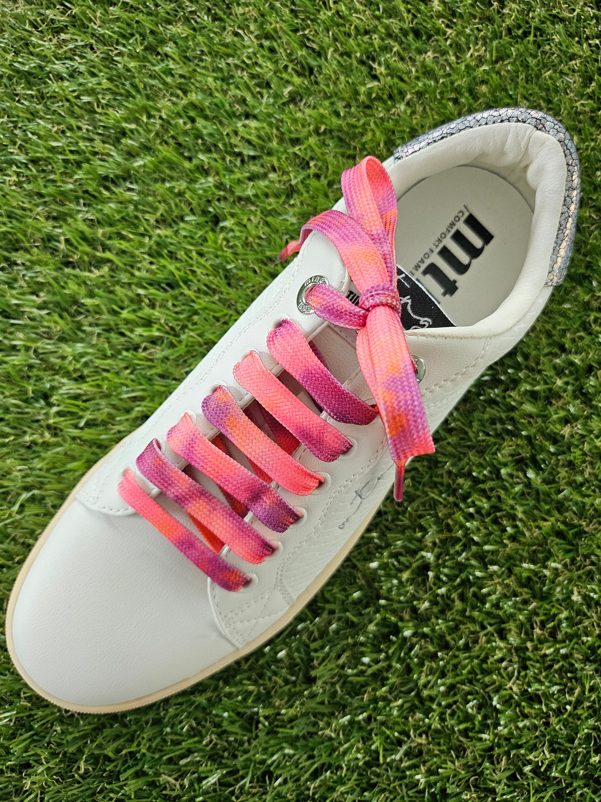 Peach Melba Coloured Shoelaces on green grass