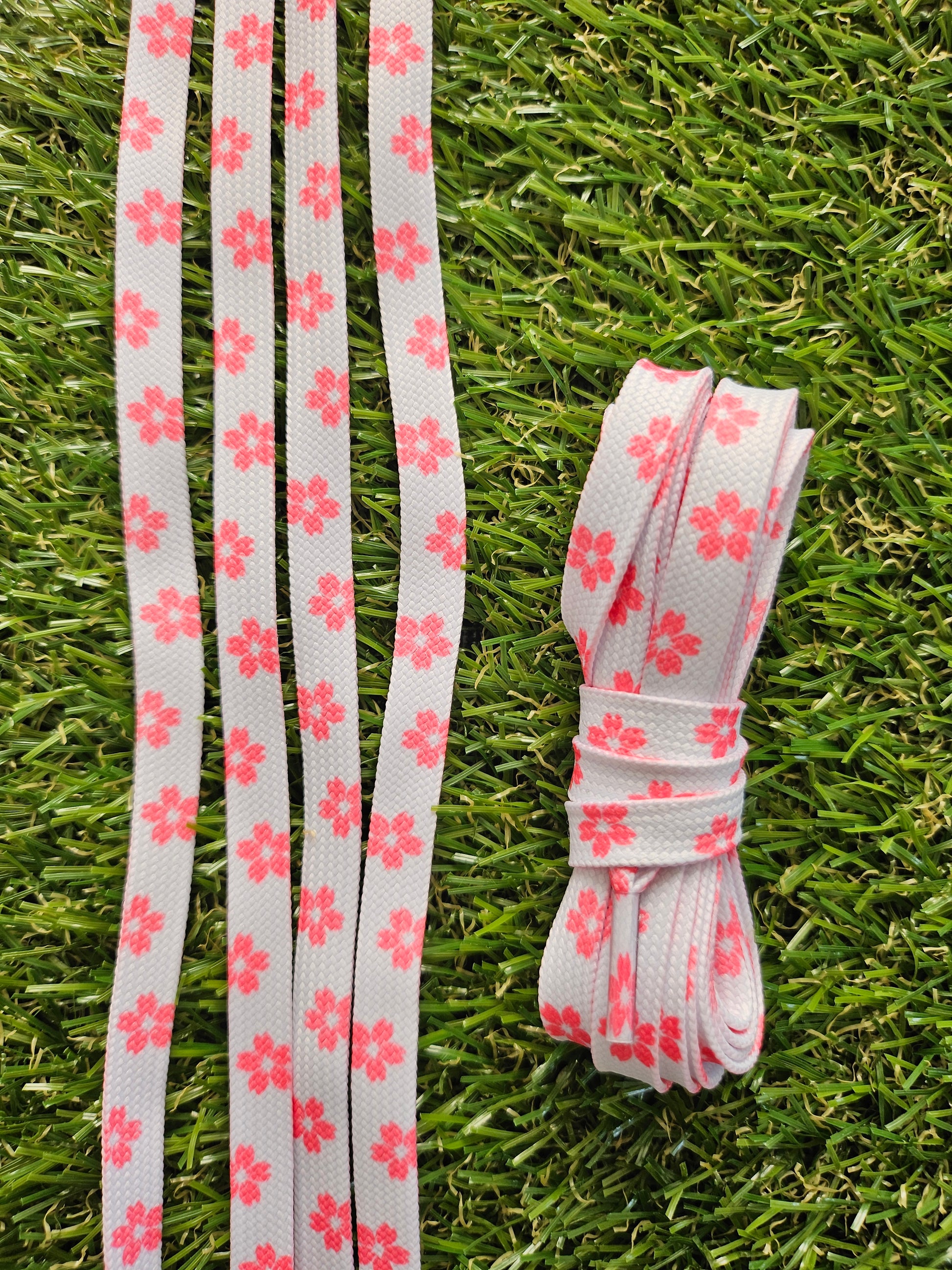 Pink Blossom Floral ShoeLaces on grass 