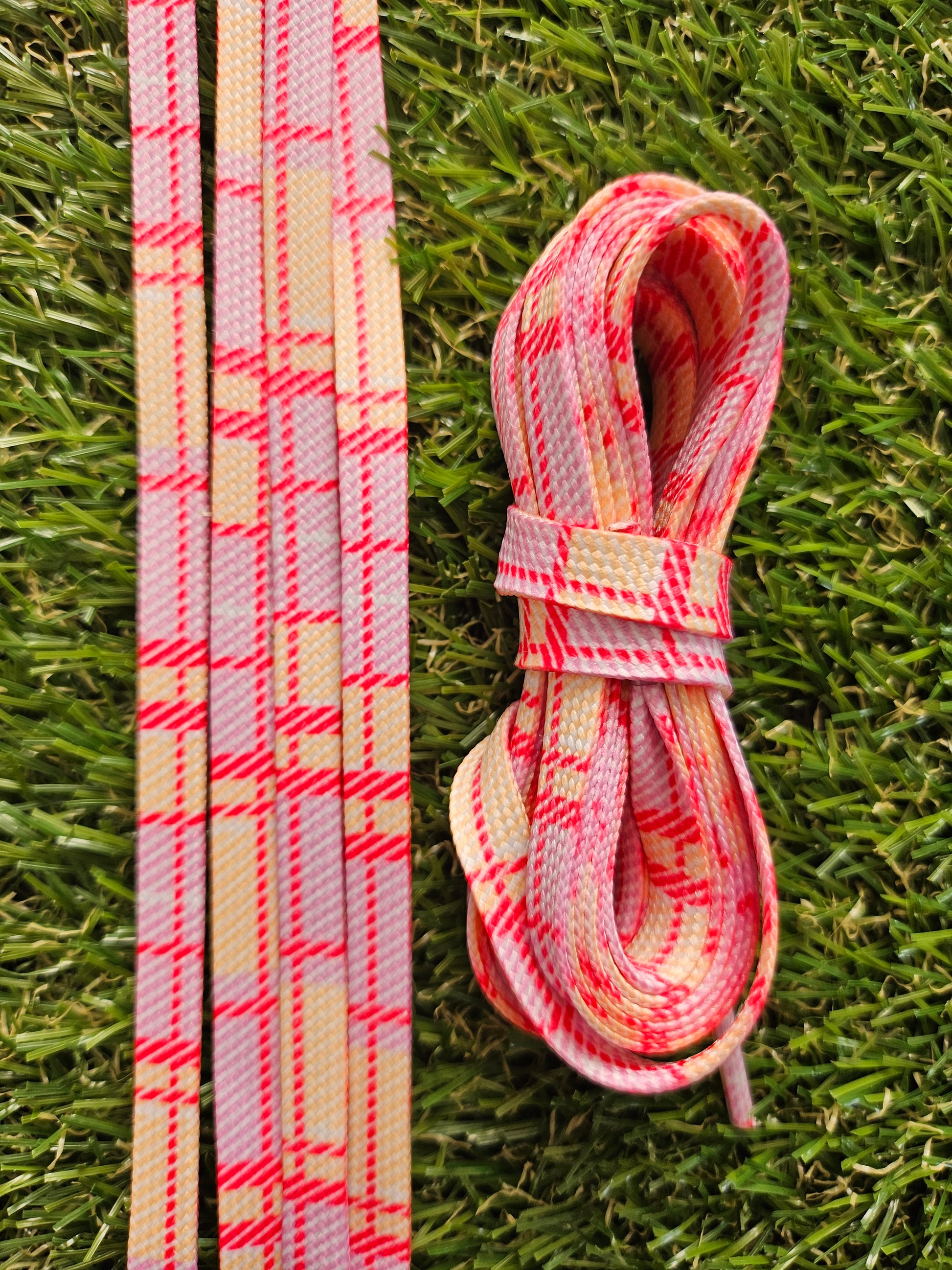 Pink and Yellow Tartan patterned shoelaces adding colour to white trainers
