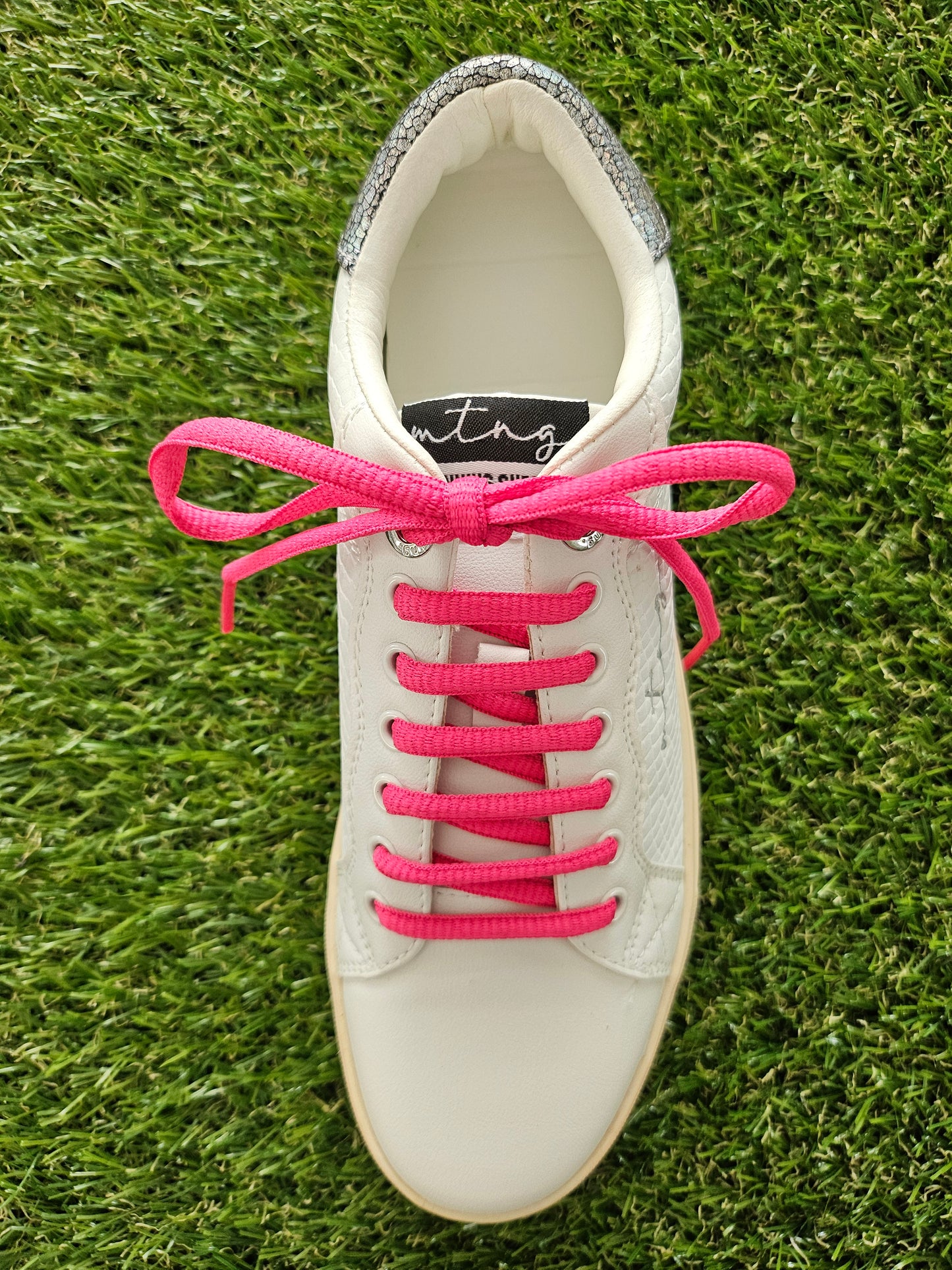 pink laces in white trainers