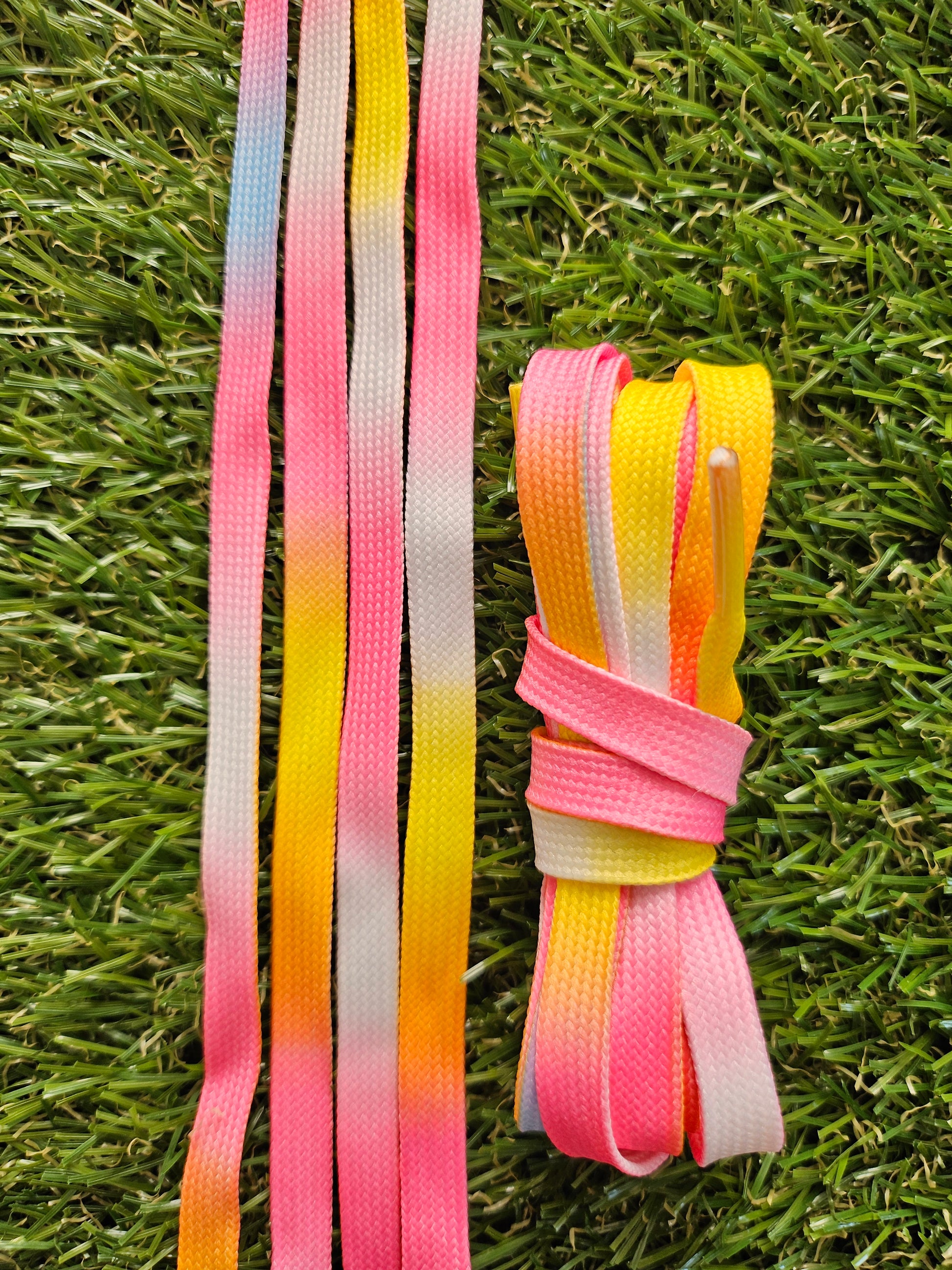 Sorbet Fade Shoelaces – Pink Yellow Blue Gradient Laces on green grass