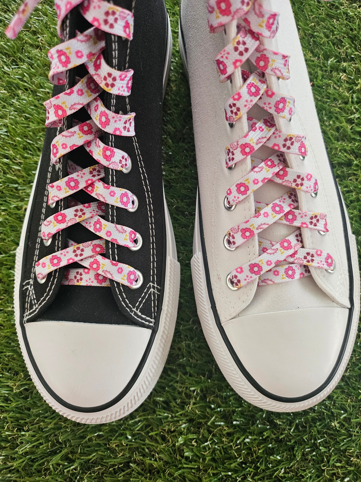 Close up of pink flowers on a white shoelace