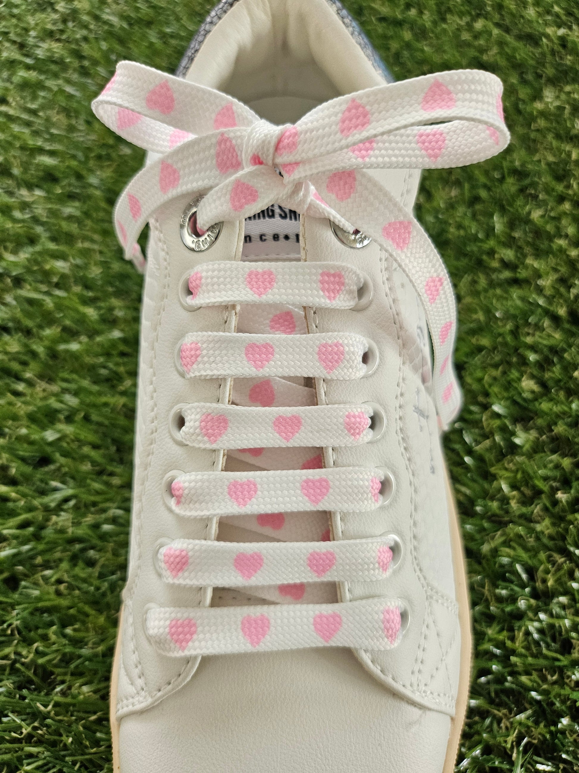 White & Pink Love Heart Laces on green grass