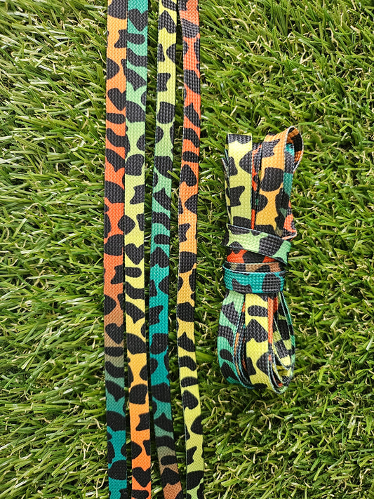 Neon colourful leopard print shoelaces on grass