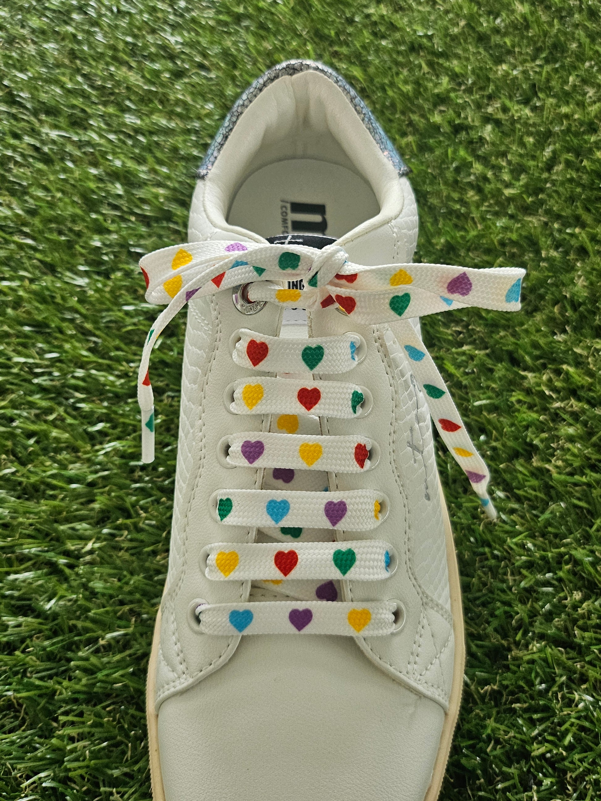 Close-up of multi-coloured heart shoelaces – fun patterned laces