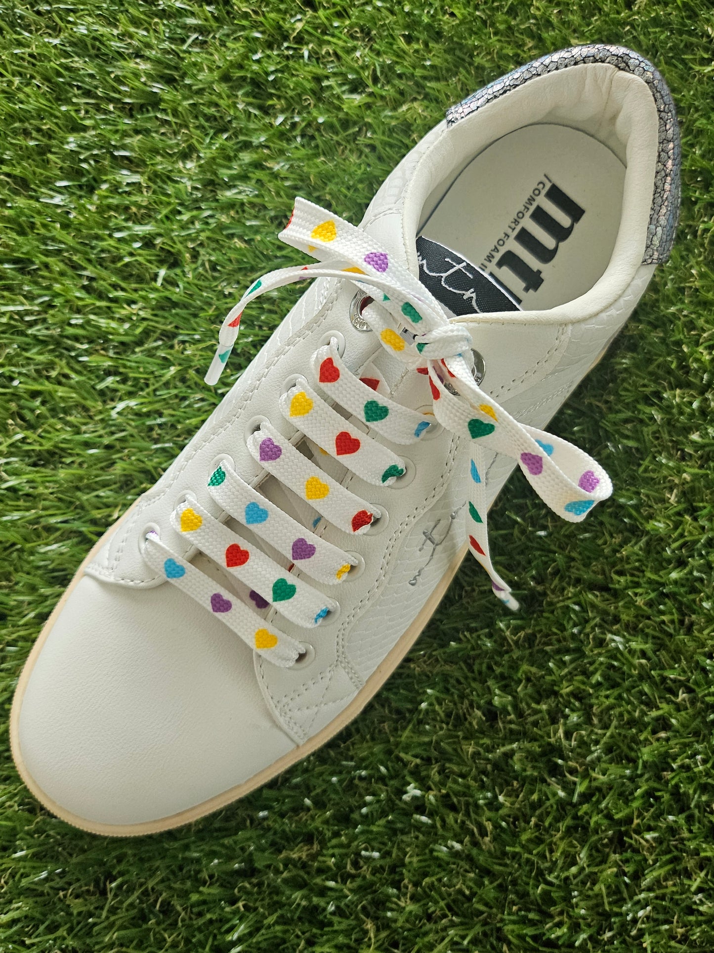 Multi-coloured heart laces threaded through trainers – Love Your Laces